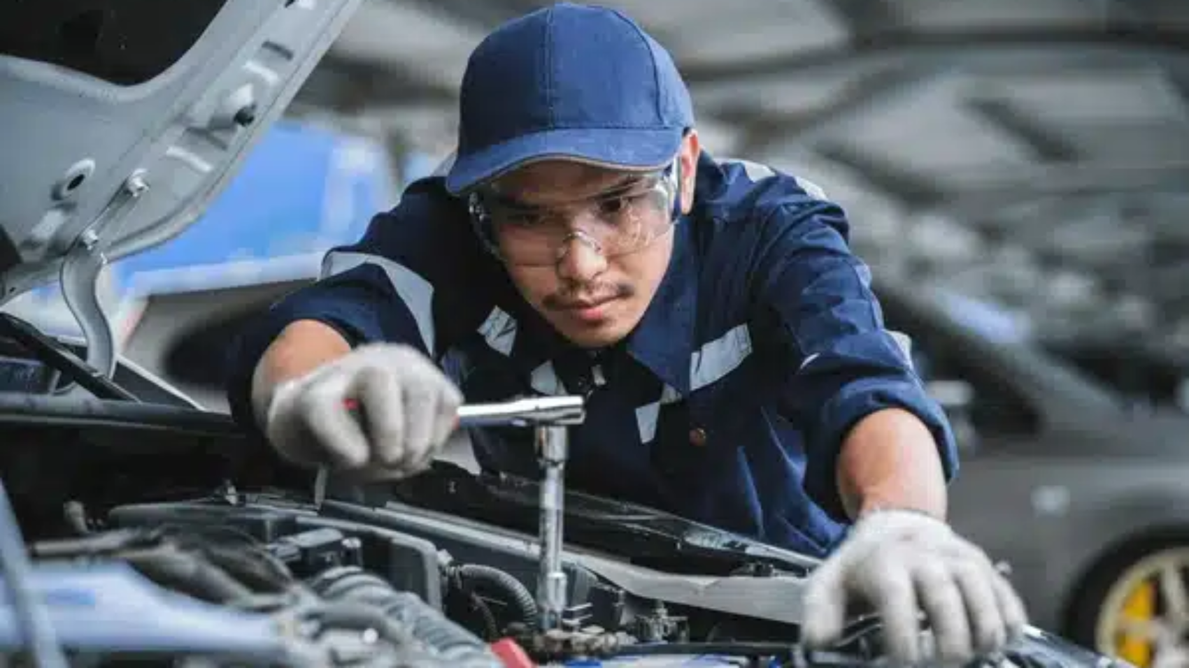 portrait-asian-mechanic-checking-safety-600nw-2180535839